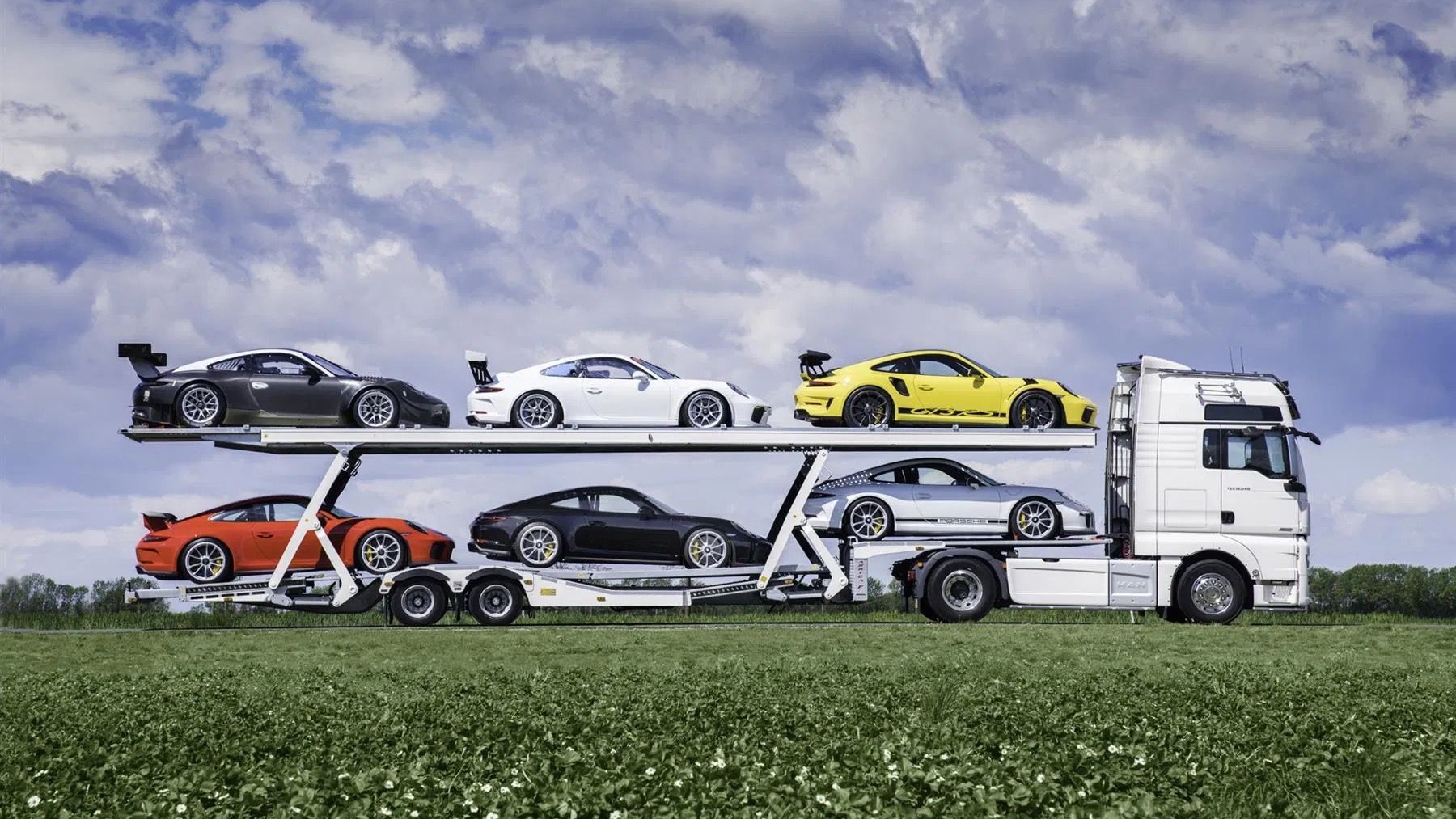 porsche-collection-with-transporter-truck-photo-via-pistonheads_100921491.jpg